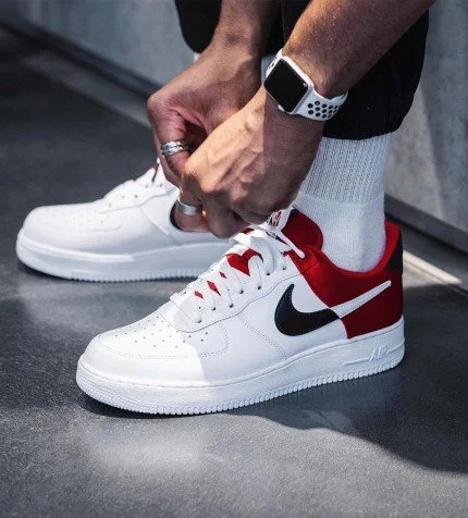White air force ones with red swoosh store